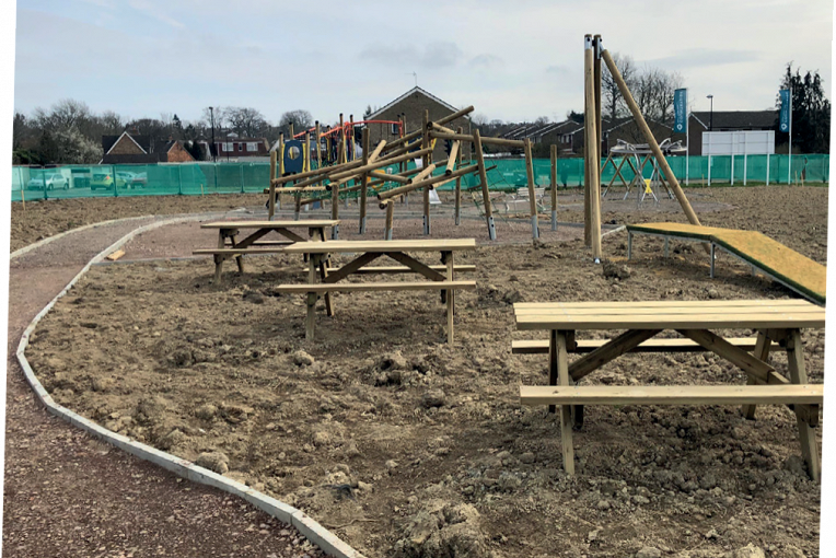 The new and improved play area under construction on Maple Drive.